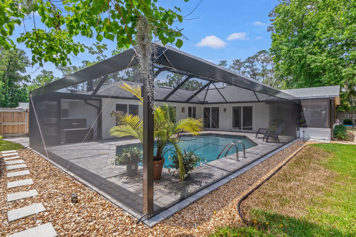 Screen Enclosure Over Pool with Landscaping